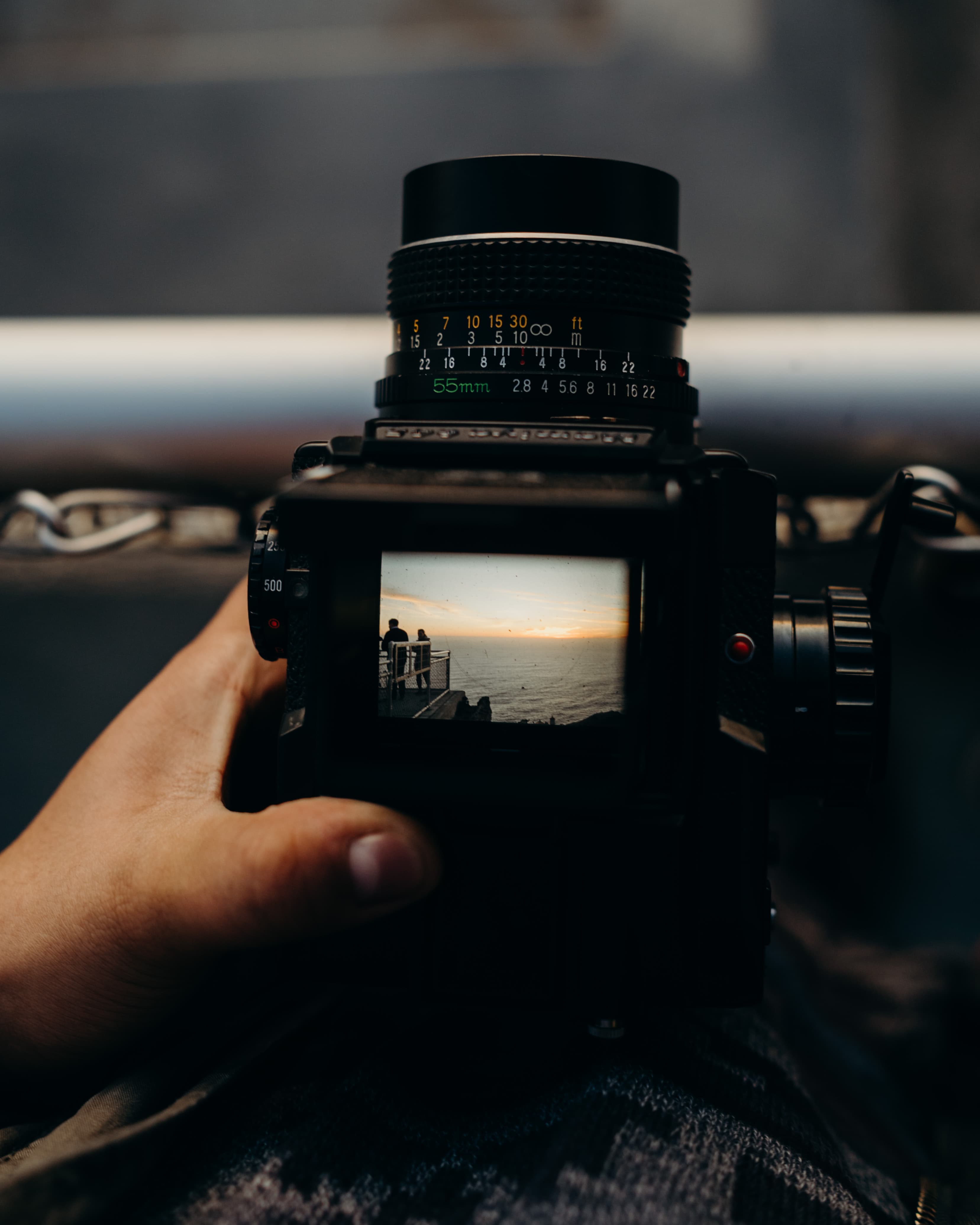 A medium-format camera framing a sunset over the ocean.